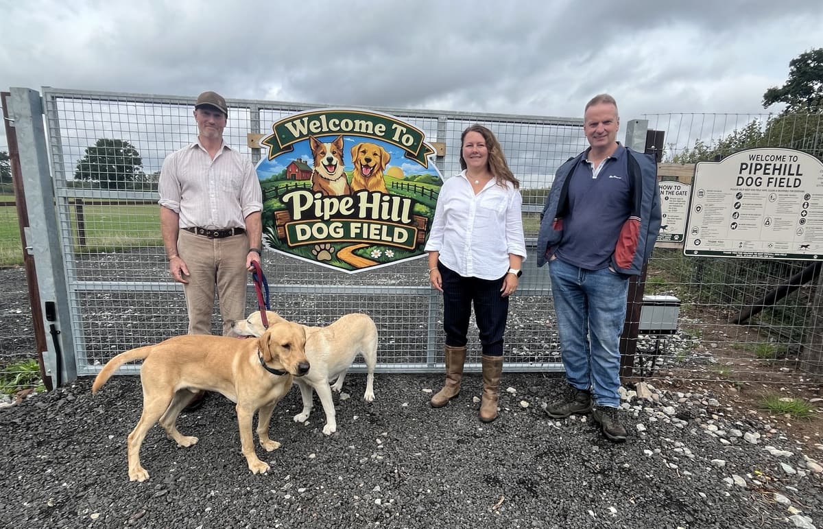 Martin and Andrew Hulme with Councillor Janice Silvester-Hall and two dogs at Pipehill Dog Field near Lichfield