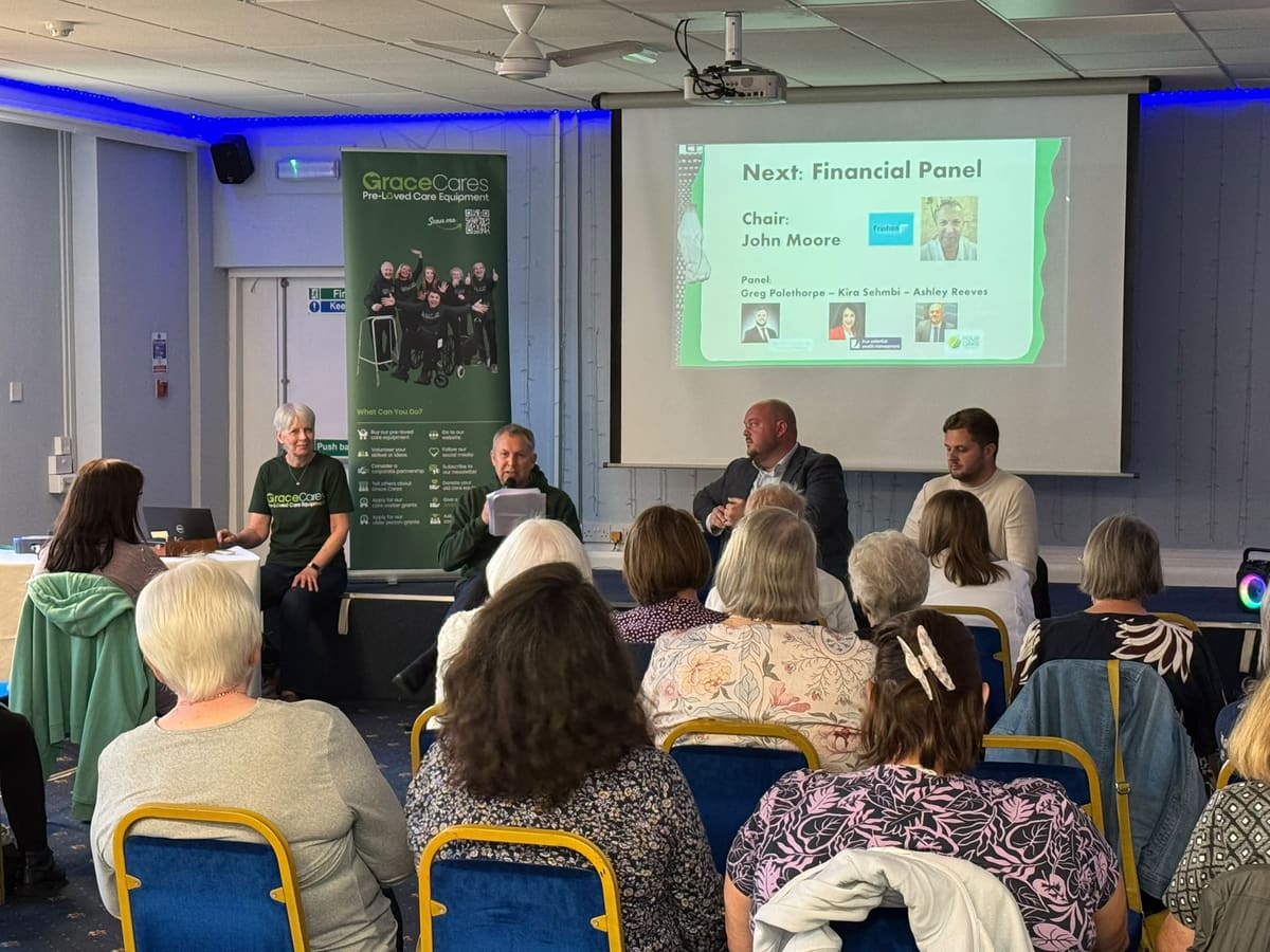Unpaid carers listening to a financial support panel at a Grace Cares Care Club session in Lichfield