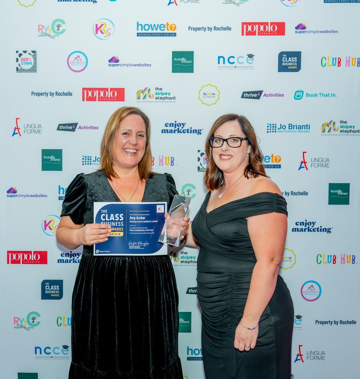 Amy Archer receiving the Team-Led Business of the Year award from Kelly Reynolds