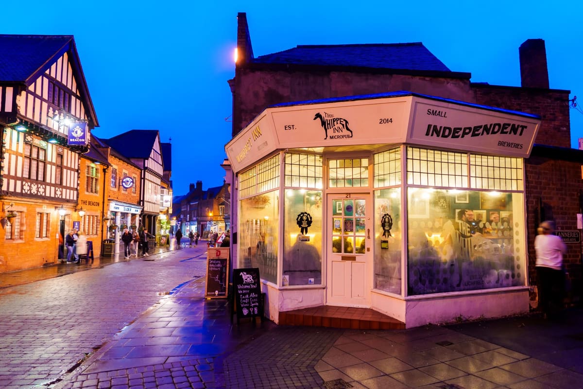 People visiting pubs on Tamworth Street in Lichfield at night