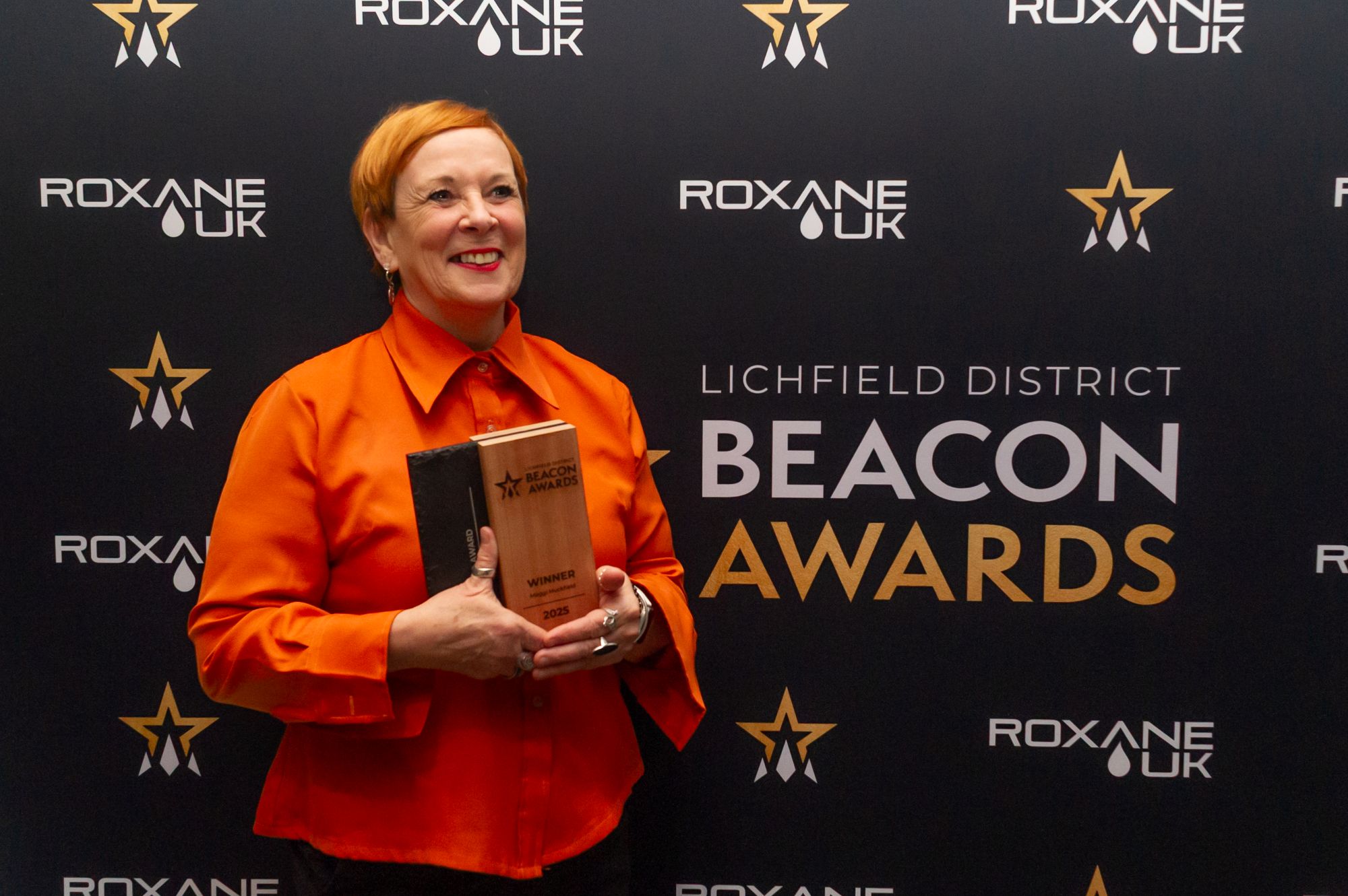 Maggi Huckfield receiving recognition at the 2025 Beacon Awards
