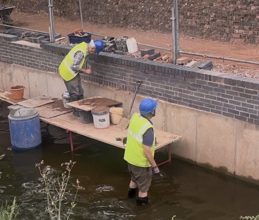 Volunteers working on the canal wall at Gallows Reach in Lichfield